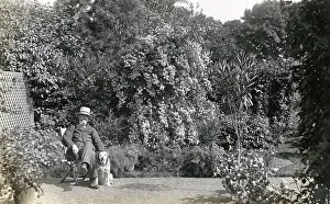 Sunhat: Man in deckchair with pet dog