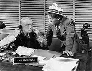 Deadline: Man at desk on telephone