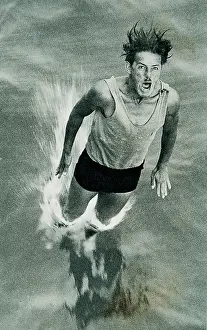 Dipping: Man dipping into the water