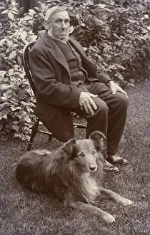 Clapham: Man with a dog in a garden