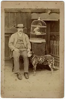 Parrots: Man with dog and parrot