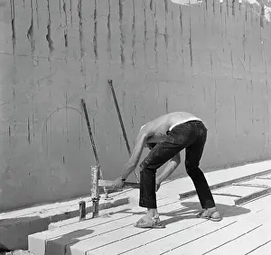 Labouring: Man doing building work on a sunny day