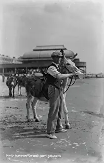 Amusement: Man with a Donkey on the Beach