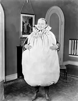 Absurd: Man dressed up as a money bag