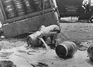 Bubbles: Man drinking from a beer keg, 1943