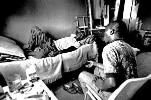 Migrate: Man drinks beer in a shebeen in Dobsonville