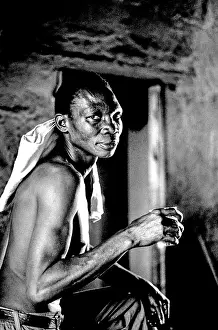 Migrate: Man drinks beer in a shebeen in Dobsonville
