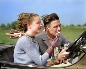 Unwise: Man Driving Convertible Automobile While Girlfriend