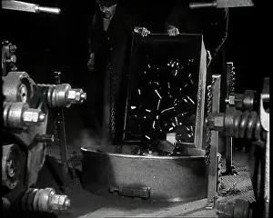 Vinyls: A Man Dumping Broken Up Vinyls to Use For War Materials