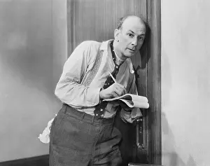 Sneaking: Man eavesdropping listening through door