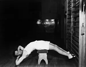Workout: Man exercising on bench
