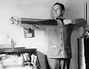 Workout: Man exercising in his office