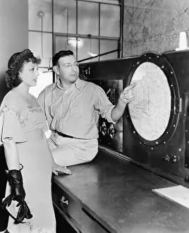 Scrutinize: Man explaining about radar to a young woman in a