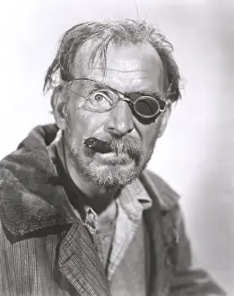 Unkempt: Man with eye patch and cigar