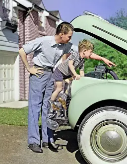 Whitewall: Man Father and Boy Son Checking Under Hood of