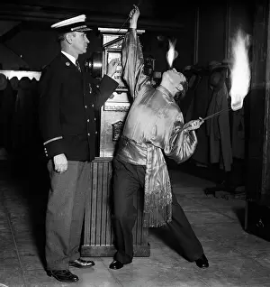 Hydrant: Man Fire Eater Circus Performer Breathing Fire and Holding