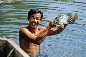Smiley: Man with fish, Bangkok