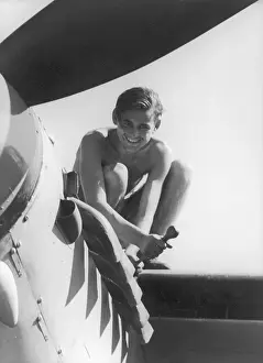 Fixing: Man fixing an aeroplane