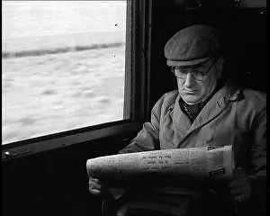Blurring: A Man in a Flat Cap and Spectacles Reading