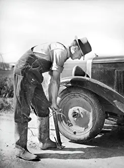 Inflate: man - flat tire - repair - car