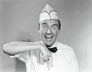 Jerk: Man Funny Facial Expression Pointing Down Wearing Groce