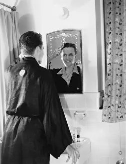 Bathrooms: Man getting ready in the bathroom