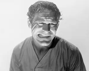 Clenching: Man gritting his teeth and grimacing