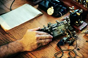 Smt001: MAN HAND TELEGRAPH OPERATOR IN RAILROAD OFFICE