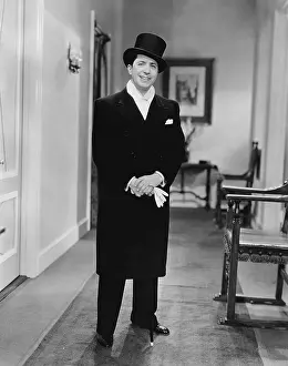 Debonair: Man in top hat and coat