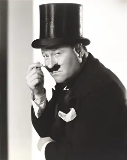 Waxed: Man in top hat with waxed mustache