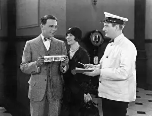 Suave: Man having to sign for a present