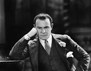 Lamenting: Man with head leaning against his hand thinking