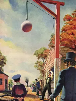 Hoists: Man hoists Large White Sphere to Signal Train
