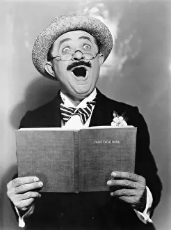 Mustaches: Man holding a book and singing