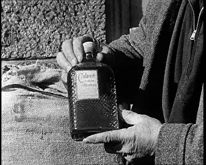 Liquor: A Man Holding A Bottle of Liquor