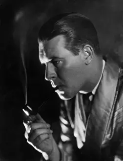 Seriousness: Man holding a cigarette