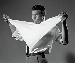 Househusband: Man holding cloth diaper folded in triangle under