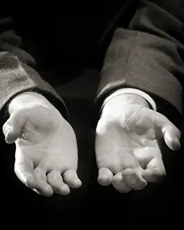 Panhandle: Man Holding Both of his Hands Out Before Him in