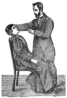 Hypnotists: Man hypnotizing woman, 1902