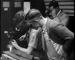Blowtorch: Man Inspecting Another Man Working With a Blowtorch