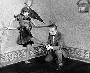 Surprises: Man inspecting womans foot