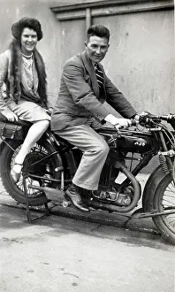 Pillion: Man & lady on a 1926/7 AJS motorcycle