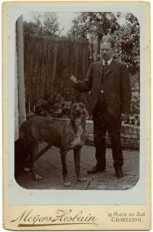 Waistcoat: Man with a large dog in a garden