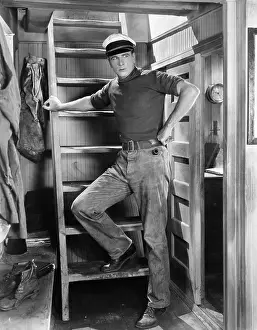 Man leaning against a ladder