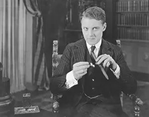 Man lighting cigar