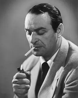 Lighters: Man lighting a cigarette