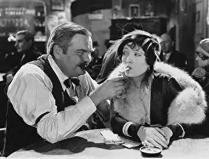 Addicts: Man lighting womans cigarette