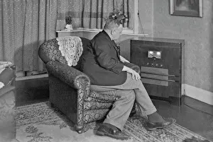 Tuning: Man listening to a radio