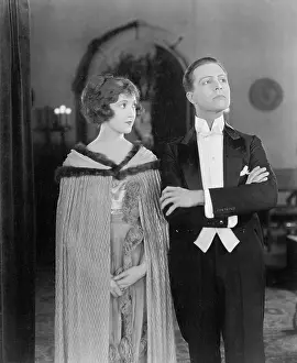 Formalwear: Man looking arrogantly away from his partner