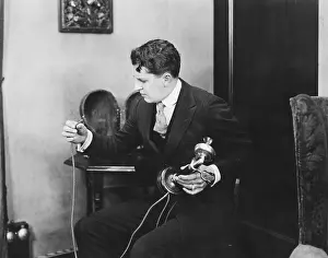 Foul: Man looking at broken telephone wire